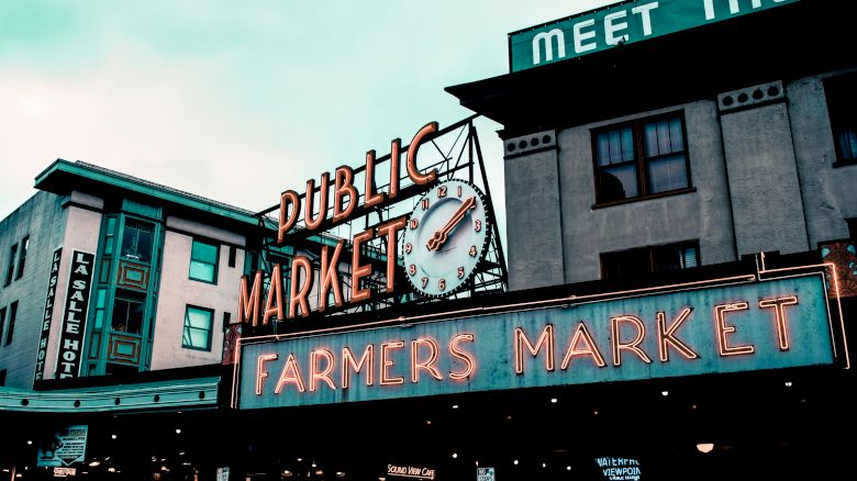 The image shows a large neon sign for a 